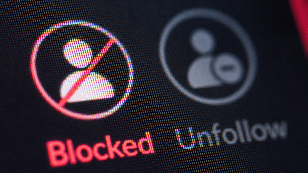 Blocked icon next to a grayed-out unfollow icon